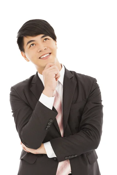 Giovane uomo d'affari Pensando e in piedi su sfondo bianco — Foto Stock