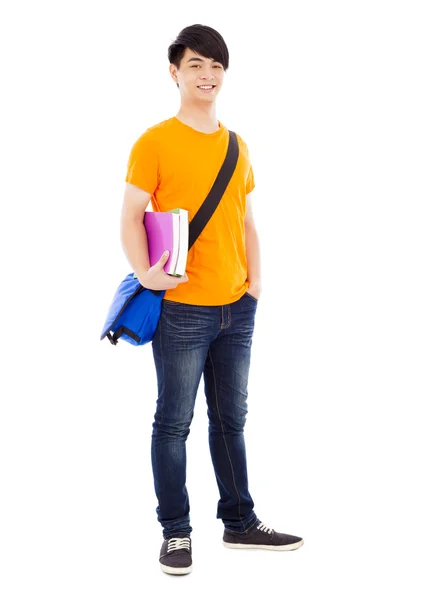 Ung student ständiga och hålla böcker — Stockfoto