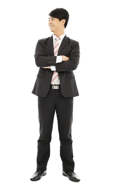 Smiling businessman standing and crossed arms — Stock Photo, Image