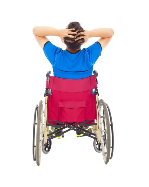 Handicapé assis sur un fauteuil roulant et pose douloureuse — Photo