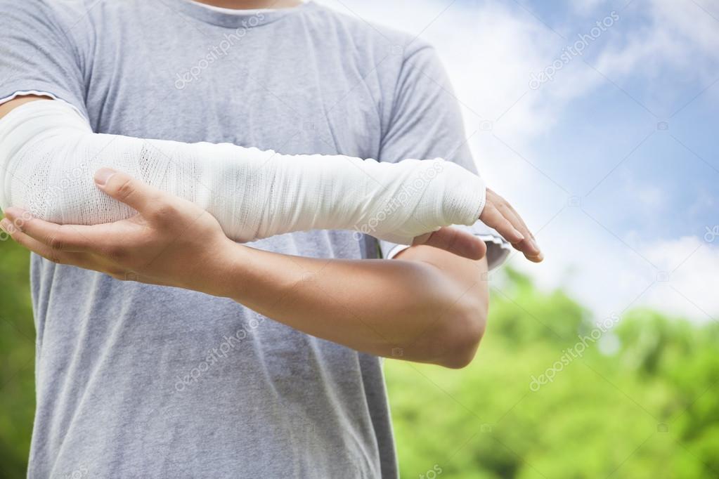 closeup of bandaged arm  in the park