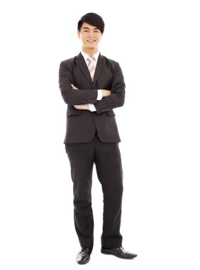 genç işadamı ayakta ve elleri arasında