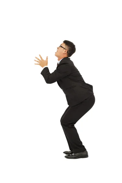 Young business man standing a funny pose with white background — Stock Photo, Image