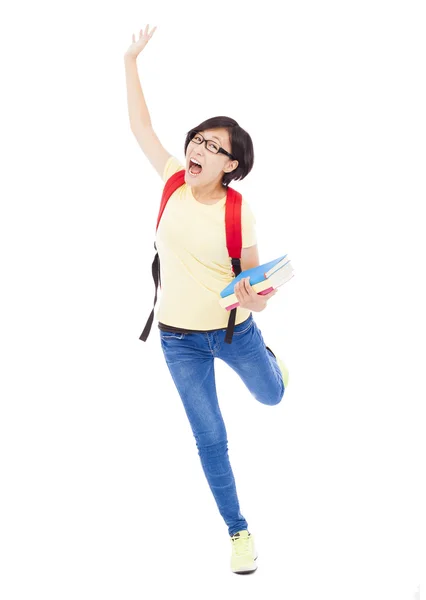 Glückliche junge Studentin rennt und hebt die Hand — Stockfoto