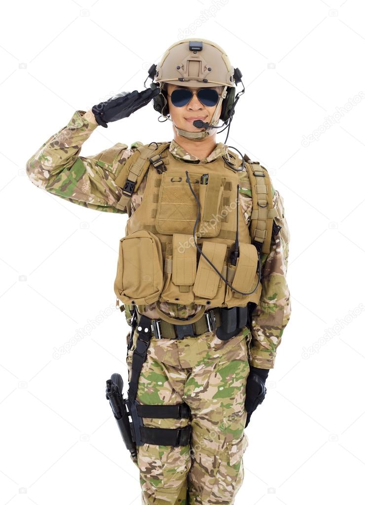 Soldier in military uniform  saluting over white background