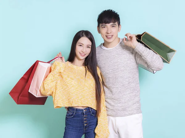 Happy Couple Shopping Bags Isolated Blue Background — Stock Photo, Image