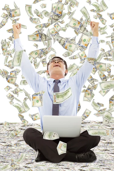 Exciting young businessman raise hands with money — Stock Photo, Image