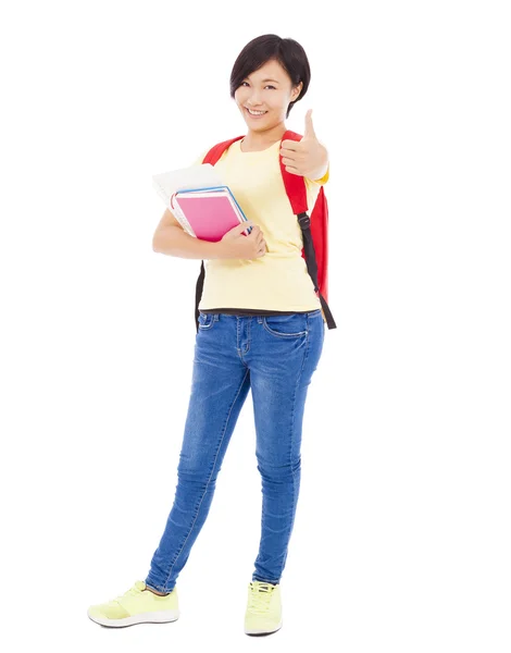 Piena lunghezza di studente ragazza in piedi e pollice in su — Foto Stock