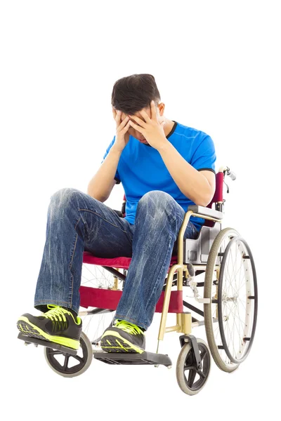 Upset handicapped man sitting on a wheelchair — Stock Photo, Image