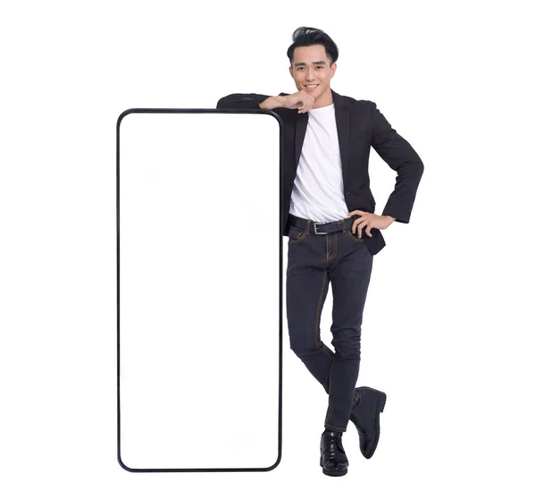 Happy Young Man Standing Leaning Big Smartphone Blank White Screen — Stock Photo, Image
