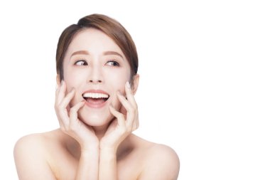 Surprised asian young beauty looking away to side