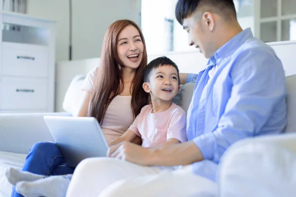 Young Happy Cheerful Family Resting Sofa Living Room Using Laptop — Photo