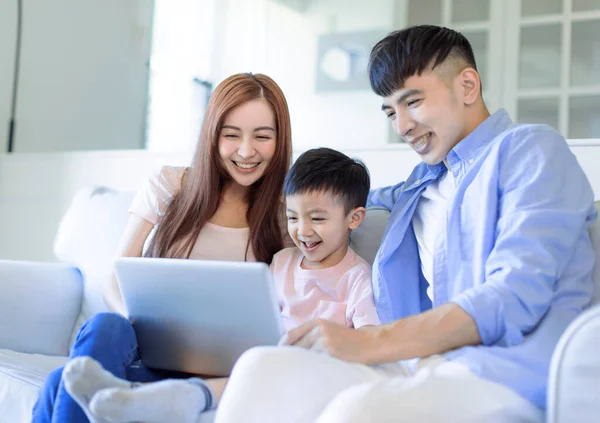 Happy Cheerful Family Resting Sofa Living Room Using Laptop — 图库照片
