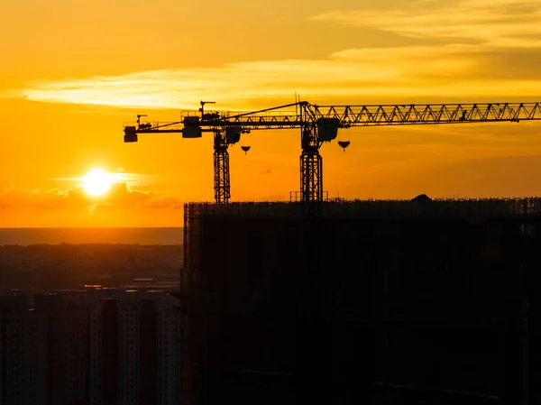 Silhouette of building site background, construction site at sunset