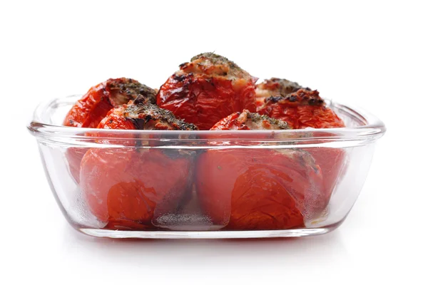 Baked stuffed tomatoes in a glass on a white background — Stock Photo, Image