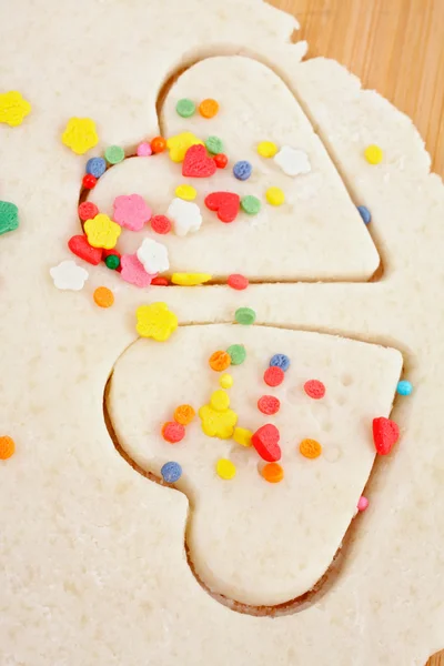 Sheet of cookie dough, hearts of pastry — Stock Photo, Image