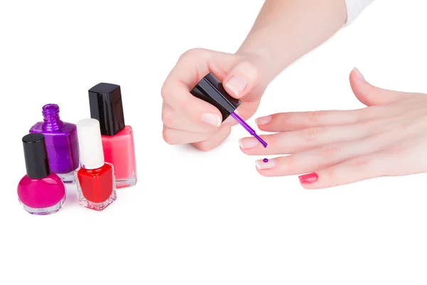 Young woman paint her nails — Stock Photo, Image