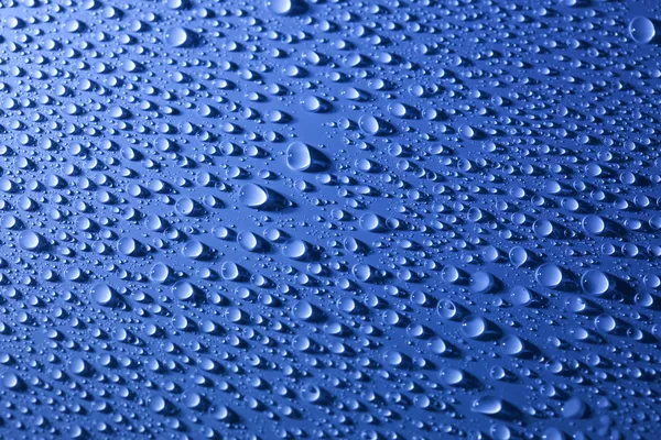 Agua grandes gotas fondo con hermosa luz — Foto de Stock