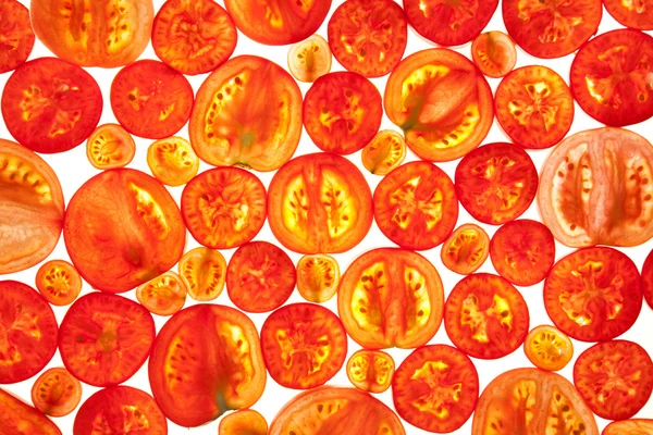 さまざまなトマトのスライスの抽象的な背景 — ストック写真