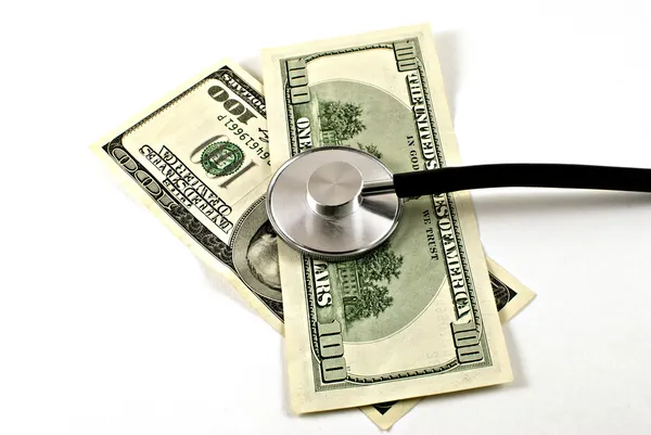 Stethoscope with dollars — Stock Photo, Image