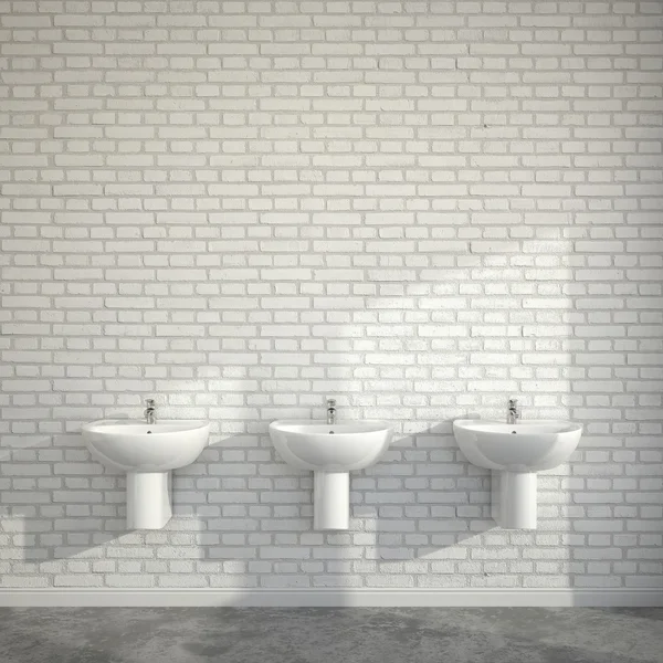 Quarto WC com três lavatórios na parede vazia de tijolos Imagem De Stock