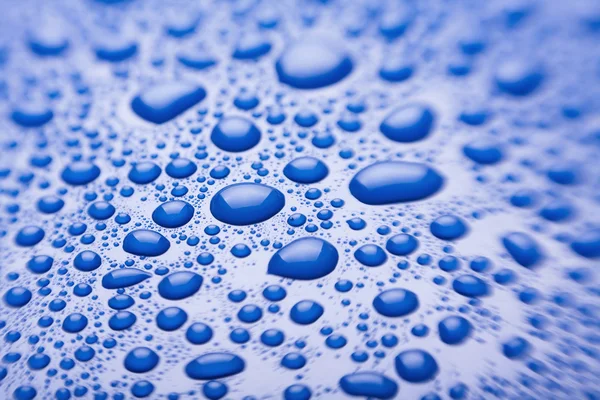 Vatten droppar blå — Stockfoto
