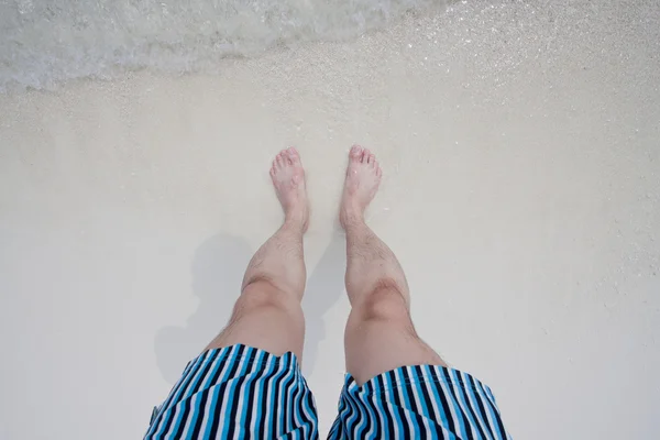 Feet on a seaside beach — Stock Photo, Image