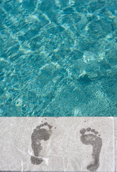 Footprints swimming pool — Stock Photo, Image