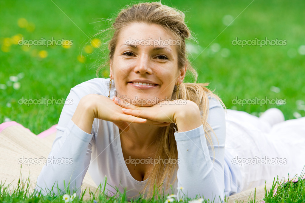 Blonde girl in park relaxing