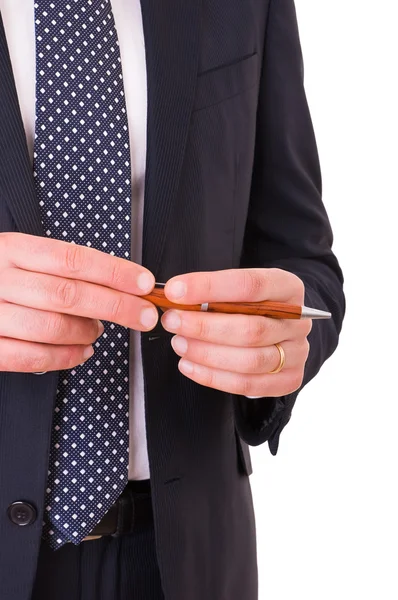 Homem de negócios segurando uma caneta . — Fotografia de Stock