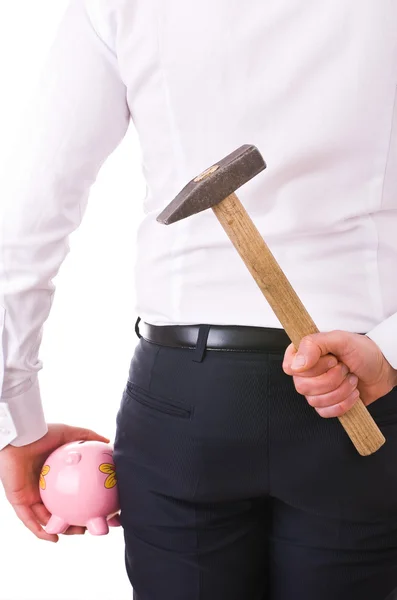 Geschäftsmann mit Sparschwein und Hammer. — Stockfoto