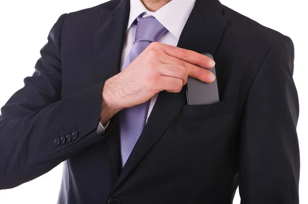 Empresario poniendo el teléfono celular en el bolsillo . — Foto de Stock