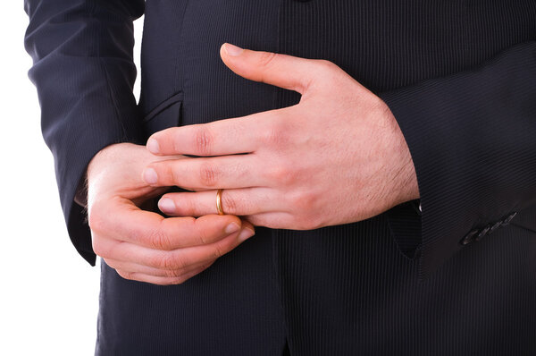 Business man taking off his wedding ring.