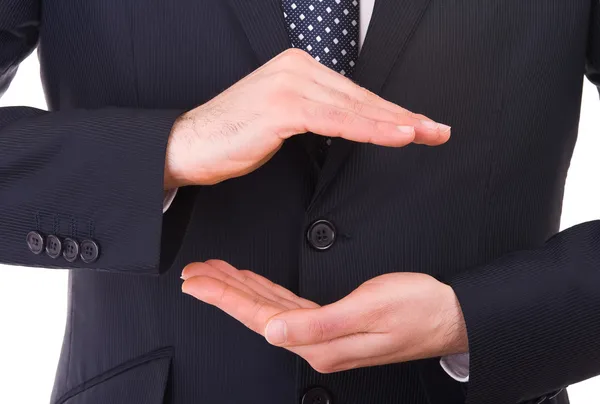 Geschäftsmann mit gestutzten Händen, als ob er etwas in der Hand hätte. — Stockfoto