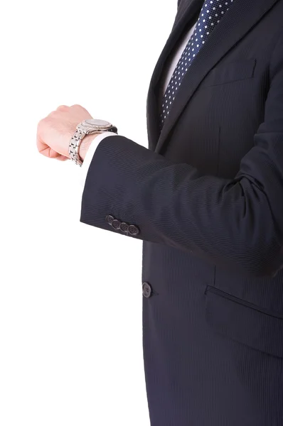 Businessman checking time on his wristwatch. Stock Image