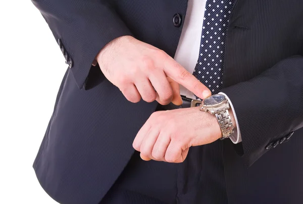 Businessman pointing at his wristwatch. Stock Photo