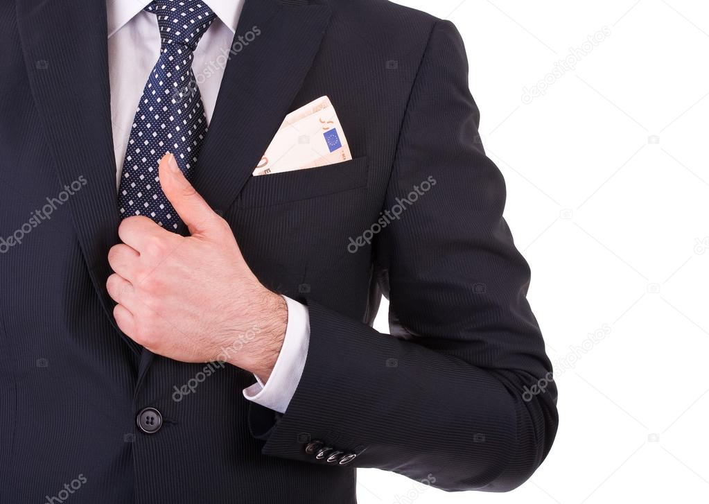 Businessman with money in suit pocket.