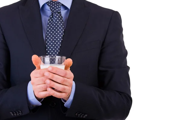 Businessman with glass of milk. — Stock Photo, Image