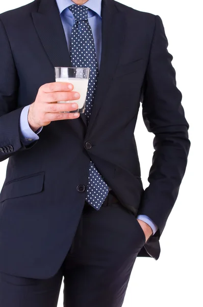 Businessman with glass of milk. — Stock Photo, Image