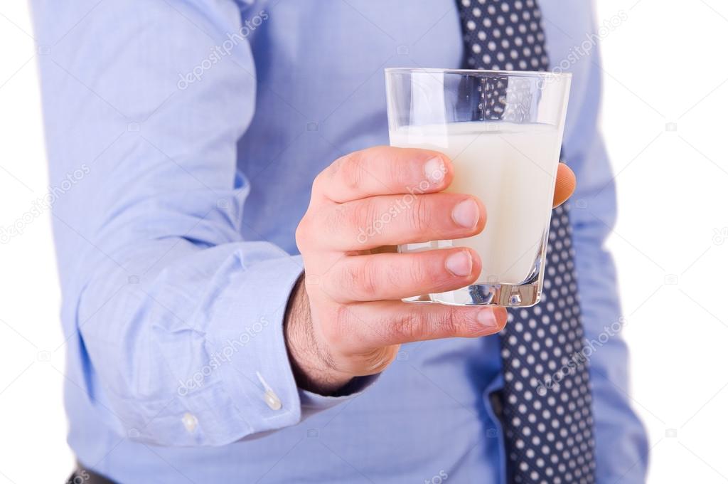 Businessman with glass of milk.