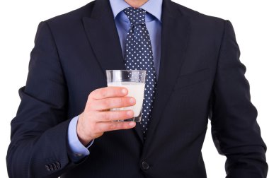 bir bardak süt ile işadamı.