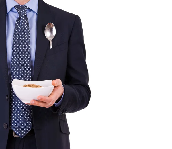 Businessman having breakfast with cereal bowl. — Stock Photo, Image