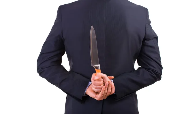 Empresario sosteniendo cuchillo detrás de su espalda . — Foto de Stock