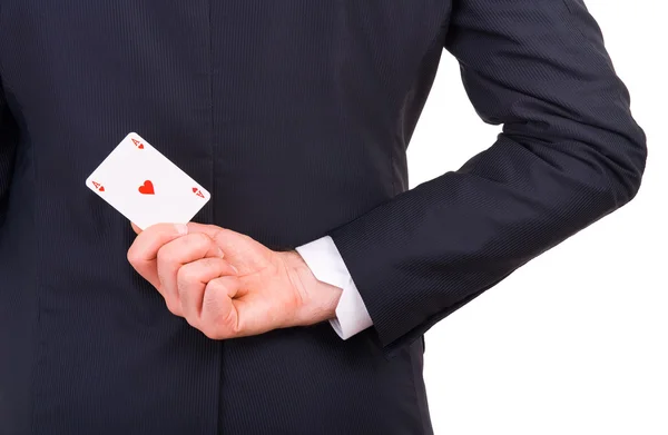 Podnikatel drží hrací karta za jeho zády. — Stock fotografie