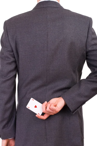 Businessman holding playing card behind his back. — Stock Photo, Image