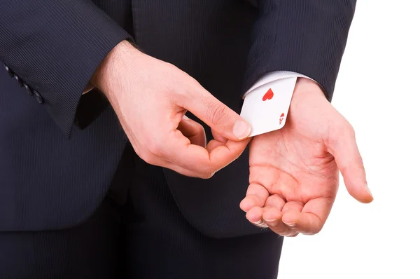 Empresario con carta de as escondida bajo la manga . — Foto de Stock