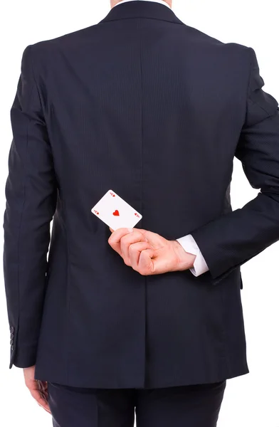 Businessman holding playing card behind his back. — Stock Photo, Image