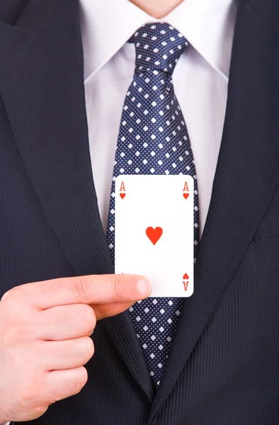 Geschäftsmann zeigt Spielkarte. — Stockfoto