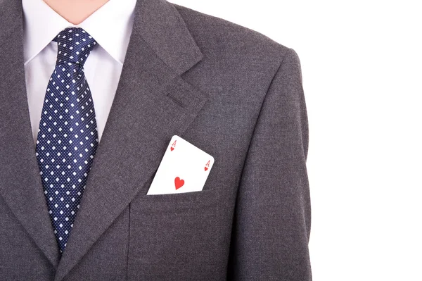 実業家は彼のポケットにエースのカードを置く. — ストック写真
