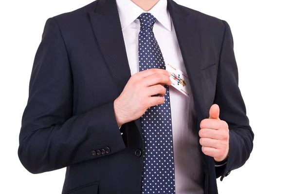 Businessman putting joker card in his pocket. — Stock Photo, Image